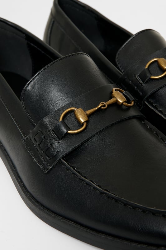 Refined elegance meets everyday comfort with these sleek snaffle loafers from Threadbare. These faux leather shoes feature a sleek slip-on design with a polished metal snaffle over the saddle. A cushioned insole offers all-day comfort, while the slight heel and durable sole add a sharp finish. Perfect for both smart and casual styling, these loafers are a versatile must-have for any modern wardrobe.