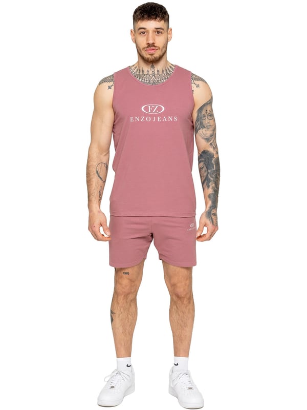 The Enzo Men's Gym Vest & Shorts Tracksuit is designed for ultimate comfort and performance. The regular-fit sleeveless vest provides a relaxed yet athletic look, with stretch material and Lycra fabric ensuring flexibility and freedom of movement. The matching gym shorts feature a regular fit and an elasticated waistband for a secure and comfortable fit. The bold Enzo Jeans branding on the chest and thigh adds a stylish, sporty touch.