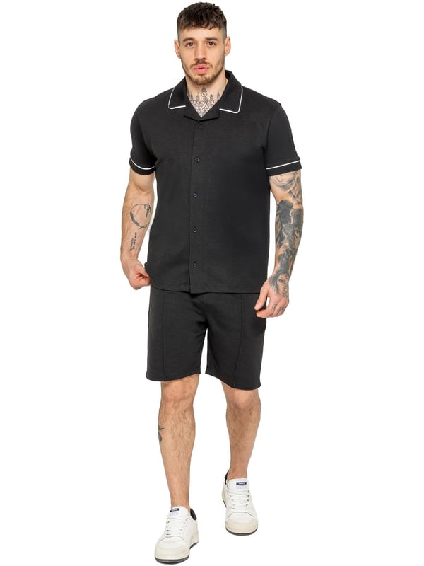 The Enzo Men's Piping Shirt & Shorts Tracksuit offers a stylish and comfortable look. The button-up shirt features a revere collar and white piping details on the collar and sleeves for a refined touch. Made from stretch fabric, it provides flexibility and a sleek fit. Paired with matching stretch shorts, this set ensures comfort and functionality with an elastic waistband, adjustable drawstring, and multiple pockets. Perfect for casual outings or lounging in style. (650&619)