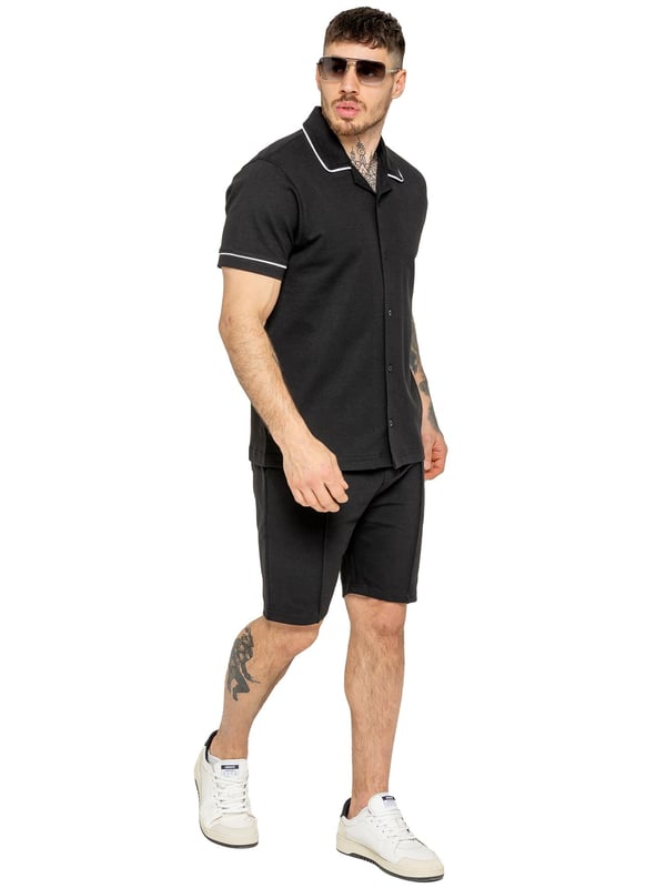 The Enzo Men's Piping Shirt & Shorts Tracksuit offers a stylish and comfortable look. The button-up shirt features a revere collar and white piping details on the collar and sleeves for a refined touch. Made from stretch fabric, it provides flexibility and a sleek fit. Paired with matching stretch shorts, this set ensures comfort and functionality with an elastic waistband, adjustable drawstring, and multiple pockets. Perfect for casual outings or lounging in style. (650&619)