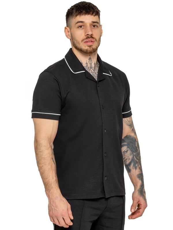 The Enzo Men's Piping Shirt & Shorts Tracksuit offers a stylish and comfortable look. The button-up shirt features a revere collar and white piping details on the collar and sleeves for a refined touch. Made from stretch fabric, it provides flexibility and a sleek fit. Paired with matching stretch shorts, this set ensures comfort and functionality with an elastic waistband, adjustable drawstring, and multiple pockets. Perfect for casual outings or lounging in style. (650&619)