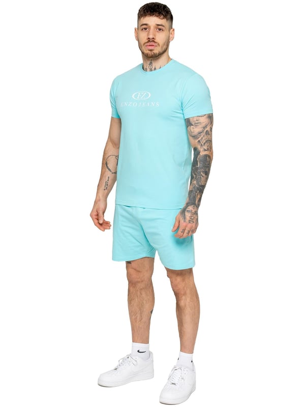 The Enzo Men's Gym Tracksuit is designed for both performance and style. The slim-fit T-shirt contours to the body for a sleek, athletic look, while the ribbed crew neck adds durability. The stretch material with Lycra fabric ensures maximum flexibility and comfort. The matching gym shorts feature a regular fit for ease of movement, with an elasticated waistband for a secure fit. The bold Enzo Jeans branding on both pieces adds a sporty edge.