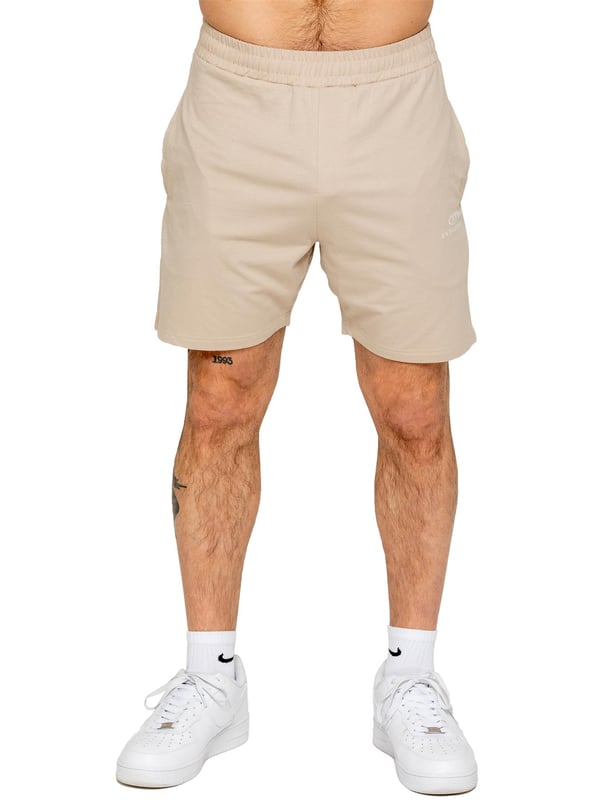 The Enzo Men's Gym Tracksuit is designed for both performance and style. The slim-fit T-shirt contours to the body for a sleek, athletic look, while the ribbed crew neck adds durability. The stretch material with Lycra fabric ensures maximum flexibility and comfort. The matching gym shorts feature a regular fit for ease of movement, with an elasticated waistband for a secure fit. The bold Enzo Jeans branding on both pieces adds a sporty edge.