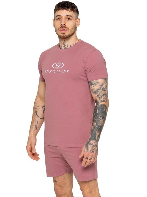 The Enzo Men's Gym Tracksuit is designed for both performance and style. The slim-fit T-shirt contours to the body for a sleek, athletic look, while the ribbed crew neck adds durability. The stretch material with Lycra fabric ensures maximum flexibility and comfort. The matching gym shorts feature a regular fit for ease of movement, with an elasticated waistband for a secure fit. The bold Enzo Jeans branding on both pieces adds a sporty edge.