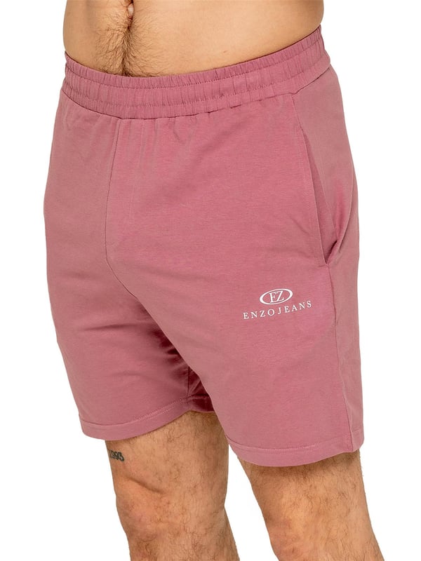 The Enzo Men's Gym Tracksuit is designed for both performance and style. The slim-fit T-shirt contours to the body for a sleek, athletic look, while the ribbed crew neck adds durability. The stretch material with Lycra fabric ensures maximum flexibility and comfort. The matching gym shorts feature a regular fit for ease of movement, with an elasticated waistband for a secure fit. The bold Enzo Jeans branding on both pieces adds a sporty edge.
