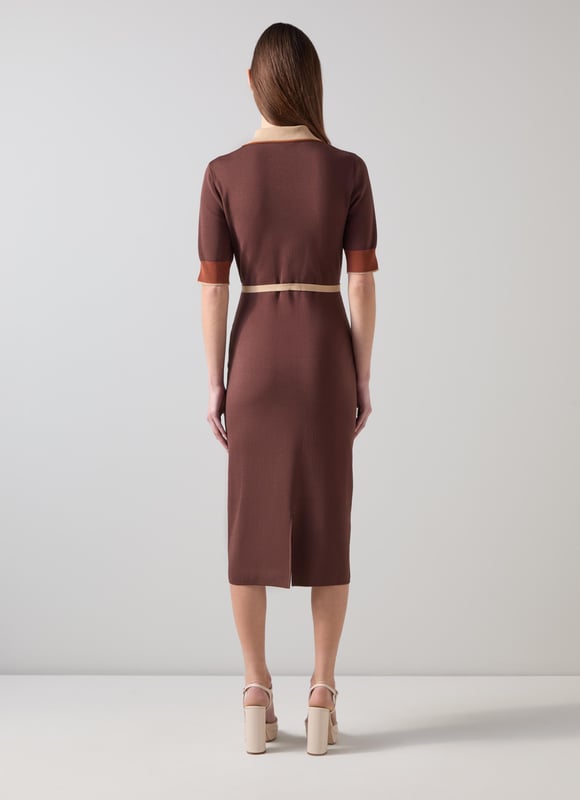 LK Bennett Rosey Dresses, Brown Imagine being in the epitome of sophistication with our Rosey chain belt trim Milano knit dress. This black colourblock dress, made from a luxurious viscose mix, features a gold effect metal snaffle, buttons, and a stretch knit design for effortless elegance. Perfectly pair it with classic pumps for work or stylish ankle boots for a night out.
