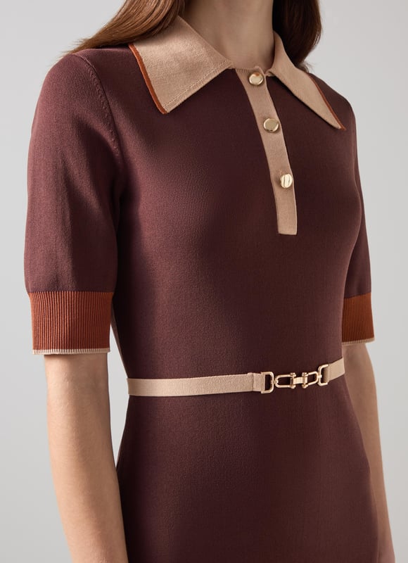 LK Bennett Rosey Dresses, Brown Imagine being in the epitome of sophistication with our Rosey chain belt trim Milano knit dress. This black colourblock dress, made from a luxurious viscose mix, features a gold effect metal snaffle, buttons, and a stretch knit design for effortless elegance. Perfectly pair it with classic pumps for work or stylish ankle boots for a night out.