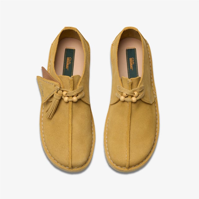 Desert Trek shoes feature a signature central butt seam, upper crafted from premium suede for durability and style. Designed with a lace-up fastening and a distinctive contrast crepe sole for all-day comfort and traction