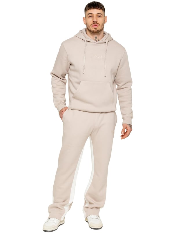 The Enzo Milano Men's Flared Joggers offer a perfect blend of comfort and style with a relaxed fit. Designed with an elasticated waistband and adjustable drawstring, they provide a customizable fit for maximum comfort. The joggers feature a contrast inner panel for a unique, stylish touch. With two side pockets for convenience and a sleek Enzo Milano rubber print on the leg, these joggers make a bold statement while staying practical.