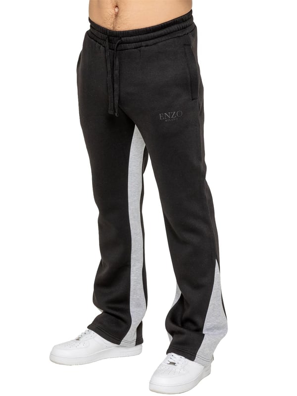 The Enzo Milano Men's Flared Joggers offer a perfect blend of comfort and style with a relaxed fit. Designed with an elasticated waistband and adjustable drawstring, they provide a customizable fit for maximum comfort. The joggers feature a contrast inner panel for a unique, stylish touch. With two side pockets for convenience and a sleek Enzo Milano rubber print on the leg, these joggers make a bold statement while staying practical.