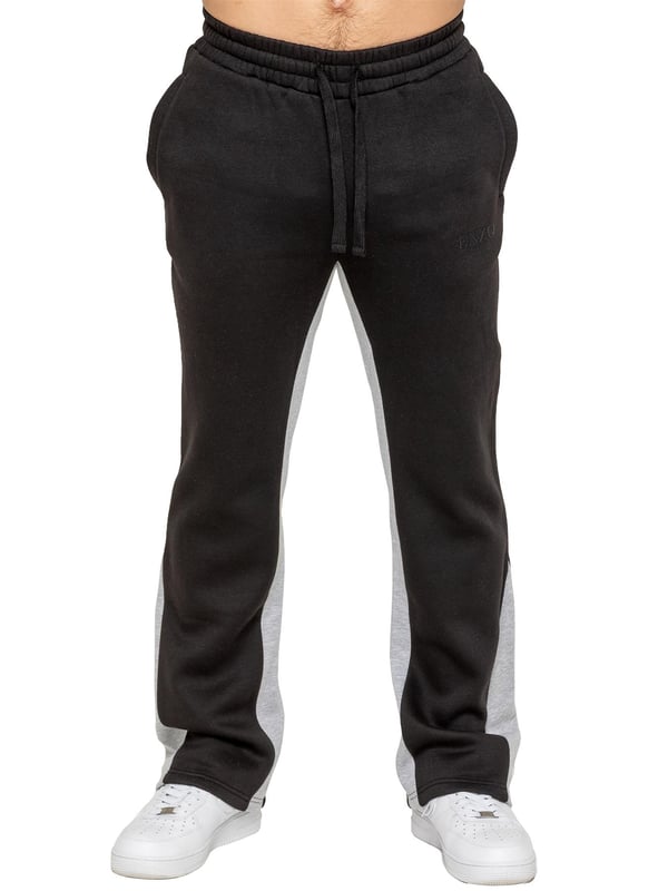The Enzo Milano Men's Flared Joggers offer a perfect blend of comfort and style with a relaxed fit. Designed with an elasticated waistband and adjustable drawstring, they provide a customizable fit for maximum comfort. The joggers feature a contrast inner panel for a unique, stylish touch. With two side pockets for convenience and a sleek Enzo Milano rubber print on the leg, these joggers make a bold statement while staying practical.