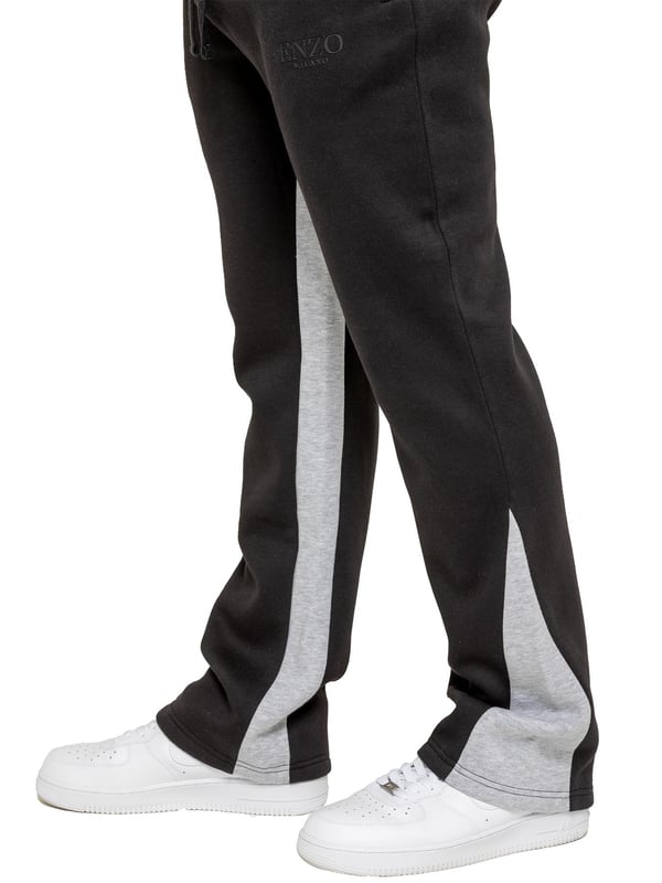 The Enzo Milano Men's Flared Joggers offer a perfect blend of comfort and style with a relaxed fit. Designed with an elasticated waistband and adjustable drawstring, they provide a customizable fit for maximum comfort. The joggers feature a contrast inner panel for a unique, stylish touch. With two side pockets for convenience and a sleek Enzo Milano rubber print on the leg, these joggers make a bold statement while staying practical.