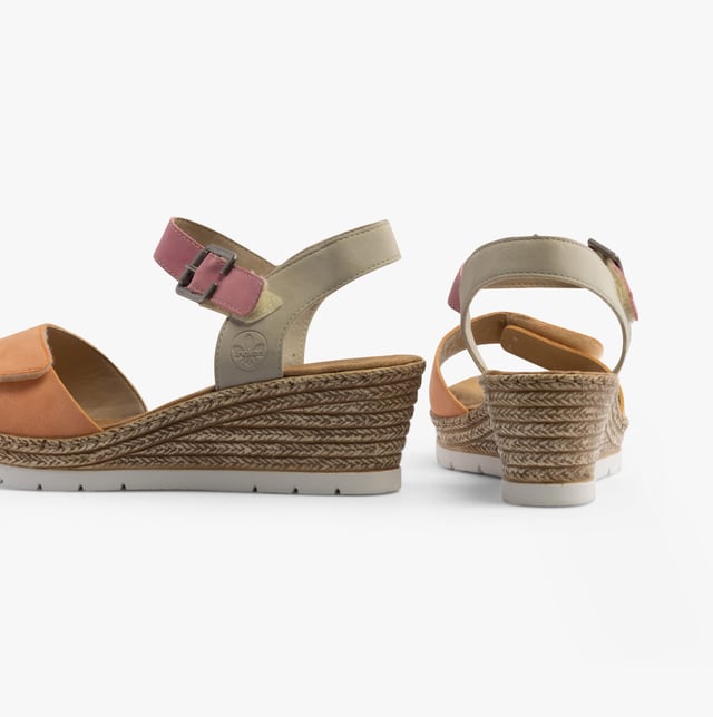 Rieker 61960-90 Womens Sandals Multi

 Upper Material: Synthetic

Lining Material: Textile

Sole Material: Synthetic

Closure/Fastening: Buckle,Touch Fasten

Features: Comfort,Breathable

Heel Type: Wedge

Shoe Width: Relaxed

Item Weight: 1 KG

Heel Height: Medium (5-7.4cm)

Sandal Style: Sandals

Gift Boxed: No
Product Code: 61960-90
