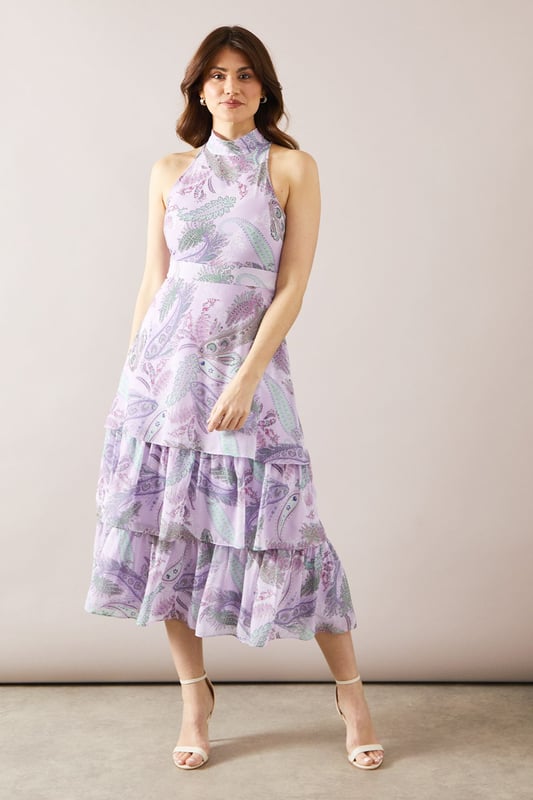Elegant halterneck design for a sophisticated look
        Tiered midaxi length offering graceful movement
        Alluring floral print throughout the dress
        Sleeveless style perfect for warm-weather events
        Flattering fitted bodice transitioning into a flowing skirt
    
    This stunning halterneck tiered midaxi dress from Wallis is the epitome of refined elegance. The dress features a captivating floral print that adds a touch of romance to your ensemble. Its tiered design creates beautiful movement as you walk, while the fitted bodice accentuates your silhouette before flowing into a graceful skirt. Perfect for formal occasions, this dress will make you feel confident and glamorous at weddings, races, or graduations. Style it with strappy heels and a clutch bag for a polished look. For cooler evenings, drape a lightweight shawl over your shoulders. The versatile design allows for easy transition from day to night events, ensuring you remain the picture of sophistication throughout any occasion.
