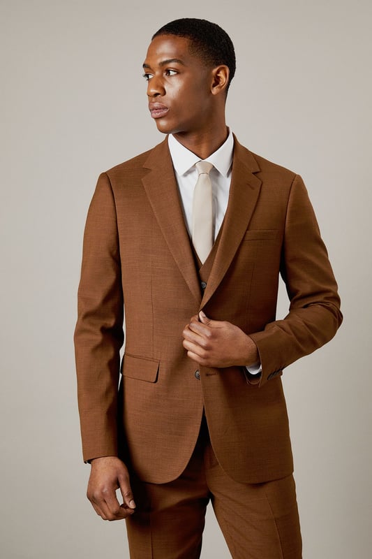 Slim fit design for a modern, tailored silhouette
        Notched lapels for a classic suit jacket appearance
        Two-button front closure for versatile styling
        Flap pockets at the waist for practicality and style
        Subtle twill texture adds depth to the fabric
    
    This Burton slim fit suit jacket is the epitome of refined style for the modern gentleman. Perfect for those who appreciate classic tailoring with a contemporary edge, this jacket offers a sleek silhouette that flatters the figure without compromising on comfort. The versatile design makes it ideal for a range of occasions, from important business meetings to sophisticated evening events. Style it with the matching trousers and waistcoat for a complete look, or pair it with dark denim and a crisp white shirt for a smart-casual ensemble. The subtle twill texture adds an interesting dimension to the fabric, ensuring you stand out for all the right reasons. Whether you're heading to the office, a wedding, or meeting friends at an upscale pub, this jacket will help you project confidence and style.