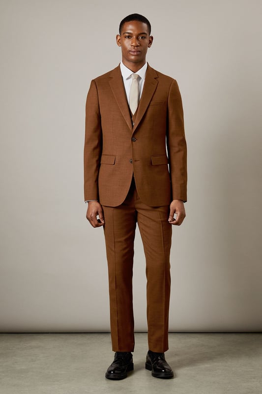 Slim fit design for a modern, tailored silhouette
        Notched lapels for a classic suit jacket appearance
        Two-button front closure for versatile styling
        Flap pockets at the waist for practicality and style
        Subtle twill texture adds depth to the fabric
    
    This Burton slim fit suit jacket is the epitome of refined style for the modern gentleman. Perfect for those who appreciate classic tailoring with a contemporary edge, this jacket offers a sleek silhouette that flatters the figure without compromising on comfort. The versatile design makes it ideal for a range of occasions, from important business meetings to sophisticated evening events. Style it with the matching trousers and waistcoat for a complete look, or pair it with dark denim and a crisp white shirt for a smart-casual ensemble. The subtle twill texture adds an interesting dimension to the fabric, ensuring you stand out for all the right reasons. Whether you're heading to the office, a wedding, or meeting friends at an upscale pub, this jacket will help you project confidence and style.