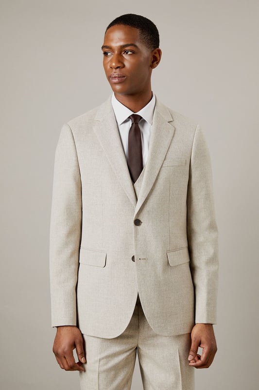 Slim fit design for a modern, tailored silhouette
        Notched lapels and two-button front closure
        Flap pockets and welt breast pocket for classic styling
        Semi-plain fabric adds subtle texture and interest
        Versatile light hue suitable for various occasions
    
    This Burton slim fit suit jacket offers a contemporary take on timeless sophistication. The semi-plain fabric adds a touch of refinement, making it an ideal choice for the discerning gentleman who appreciates classic style with a modern edge. Perfect for smart casual events or more formal occasions, this jacket can be effortlessly dressed up or down. Pair it with matching trousers and a crisp white shirt for a complete suit ensemble, or team it with dark denim and a polo shirt for a more relaxed look. The versatile hue allows for easy coordination with a range of accessories, from patterned ties to pocket squares. Whether you're heading to the office, attending a wedding, or enjoying a night out at the pub, this jacket will ensure you look polished and put-together. Its slim fit silhouette flatters the body while allowing comfortable movement, making it an excellent choice for the active man who values both style and functionality.