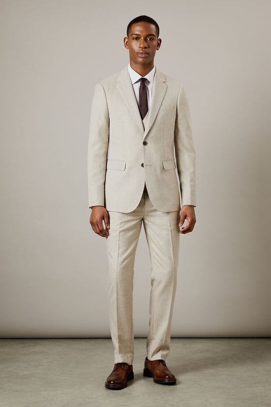 Slim fit design for a modern, tailored silhouette
        Notched lapels and two-button front closure
        Flap pockets and welt breast pocket for classic styling
        Semi-plain fabric adds subtle texture and interest
        Versatile light hue suitable for various occasions
    
    This Burton slim fit suit jacket offers a contemporary take on timeless sophistication. The semi-plain fabric adds a touch of refinement, making it an ideal choice for the discerning gentleman who appreciates classic style with a modern edge. Perfect for smart casual events or more formal occasions, this jacket can be effortlessly dressed up or down. Pair it with matching trousers and a crisp white shirt for a complete suit ensemble, or team it with dark denim and a polo shirt for a more relaxed look. The versatile hue allows for easy coordination with a range of accessories, from patterned ties to pocket squares. Whether you're heading to the office, attending a wedding, or enjoying a night out at the pub, this jacket will ensure you look polished and put-together. Its slim fit silhouette flatters the body while allowing comfortable movement, making it an excellent choice for the active man who values both style and functionality.