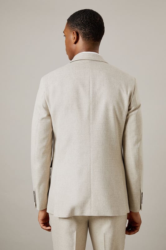 Slim fit design for a modern, tailored silhouette
        Notched lapels and two-button front closure
        Flap pockets and welt breast pocket for classic styling
        Semi-plain fabric adds subtle texture and interest
        Versatile light hue suitable for various occasions
    
    This Burton slim fit suit jacket offers a contemporary take on timeless sophistication. The semi-plain fabric adds a touch of refinement, making it an ideal choice for the discerning gentleman who appreciates classic style with a modern edge. Perfect for smart casual events or more formal occasions, this jacket can be effortlessly dressed up or down. Pair it with matching trousers and a crisp white shirt for a complete suit ensemble, or team it with dark denim and a polo shirt for a more relaxed look. The versatile hue allows for easy coordination with a range of accessories, from patterned ties to pocket squares. Whether you're heading to the office, attending a wedding, or enjoying a night out at the pub, this jacket will ensure you look polished and put-together. Its slim fit silhouette flatters the body while allowing comfortable movement, making it an excellent choice for the active man who values both style and functionality.