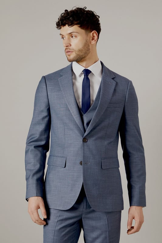 Slim fit design for a modern, tailored silhouette
        Notch lapel and two-button closure for classic styling
        Flap pockets and welt breast pocket for functionality and style
        Four-button cuffs for a refined finish
        Matching waistcoat and trousers available for a complete suit
    
    This Burton slim fit suit jacket offers a contemporary take on traditional tailoring, perfect for the modern gentleman who appreciates classic style with a refined edge. The slim fit design creates a sleek silhouette that flatters the body without compromising on comfort. Pair with the matching trousers and waistcoat for a complete look that's ideal for weddings, important business meetings, or sophisticated evening events. For a smart casual ensemble, try wearing the jacket with dark denim jeans and a crisp white shirt. The versatile design allows for easy styling - dress it up with a tie and pocket square for formal occasions, or keep it relaxed with an open-collar shirt for after-work drinks. The subtle texture of the fabric adds depth to your outfit, ensuring you stand out for all the right reasons. Whether you're heading to the office, a special celebration, or a night out at your local, this jacket will have you looking sharp and feeling confident.