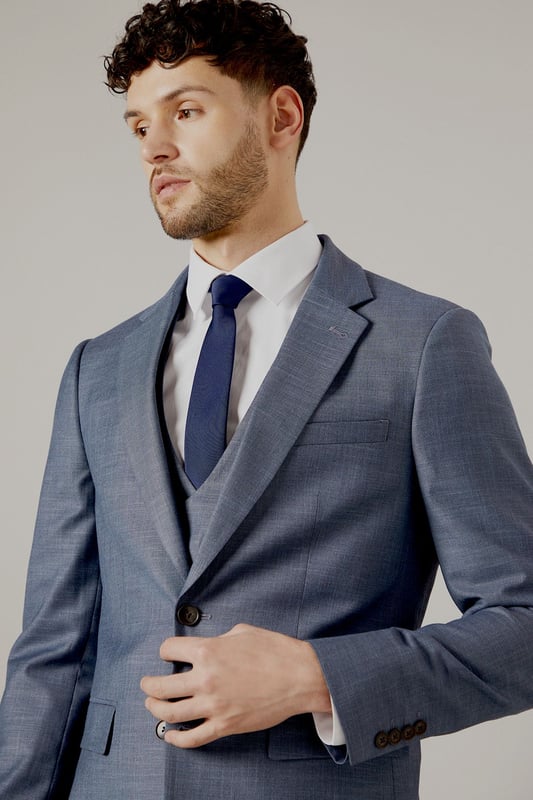Slim fit design for a modern, tailored silhouette
        Notch lapel and two-button closure for classic styling
        Flap pockets and welt breast pocket for functionality and style
        Four-button cuffs for a refined finish
        Matching waistcoat and trousers available for a complete suit
    
    This Burton slim fit suit jacket offers a contemporary take on traditional tailoring, perfect for the modern gentleman who appreciates classic style with a refined edge. The slim fit design creates a sleek silhouette that flatters the body without compromising on comfort. Pair with the matching trousers and waistcoat for a complete look that's ideal for weddings, important business meetings, or sophisticated evening events. For a smart casual ensemble, try wearing the jacket with dark denim jeans and a crisp white shirt. The versatile design allows for easy styling - dress it up with a tie and pocket square for formal occasions, or keep it relaxed with an open-collar shirt for after-work drinks. The subtle texture of the fabric adds depth to your outfit, ensuring you stand out for all the right reasons. Whether you're heading to the office, a special celebration, or a night out at your local, this jacket will have you looking sharp and feeling confident.