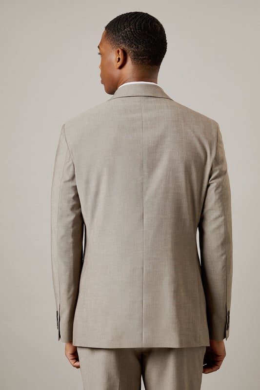 Tailored fit for a refined silhouette
        Notched lapels for classic sophistication
        Two-button front closure for versatile styling
        Flap pockets add functional elegance
        Four-button cuffs for a polished finish
    
    This Burton tailored fit suit jacket offers a perfect balance of classic style and modern cut. The jacket is designed to define your shoulders and chest while tapering at the waist for a flattering silhouette. Ideal for the gentleman who appreciates timeless elegance, this jacket is versatile enough for various occasions. Pair it with matching trousers and a crisp white shirt for formal events, or dress it down with chinos and loafers for smart-casual gatherings. The neutral hue allows for easy coordination with a range of shirt and tie combinations, making it a staple for your professional wardrobe. Whether you're heading to an important business meeting or joining mates for a sophisticated night out, this jacket will ensure you look sharp and feel confident.