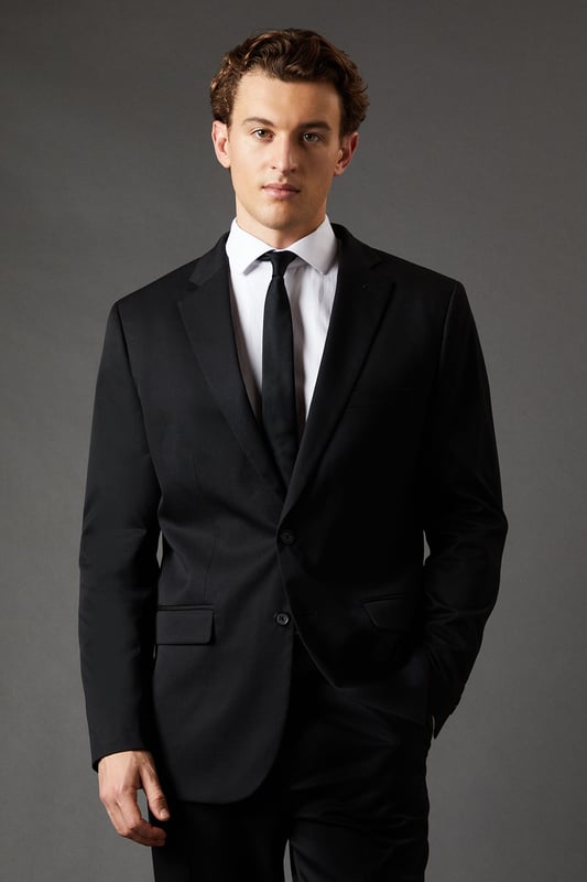 Regular fit suit jacket for a classic, comfortable silhouette
        Notched lapels for a timeless, versatile look
        Two-button front closure for easy wear
        Flap pockets at the waist for practicality and style
        Single back vent for ease of movement
    
    This Burton regular fit suit jacket is the epitome of refined British tailoring, perfect for the discerning gentleman who appreciates classic style with a modern twist. The jacket's regular fit offers a comfortable, relaxed silhouette that flatters various body types, making it an ideal choice for long days at the office or important business meetings. Pair it with matching trousers and a crisp white shirt for a complete look that exudes confidence and professionalism. For more casual affairs, such as after-work drinks or weekend gatherings at the local pub, consider teaming it with dark denim jeans and a light jumper. The versatility of this jacket allows for effortless transitions from day to night, ensuring you're always dressed to impress. Whether you're attending a wedding, giving a presentation, or enjoying a night out on the town, this Burton suit jacket is your go-to piece for looking sharp and feeling comfortable.