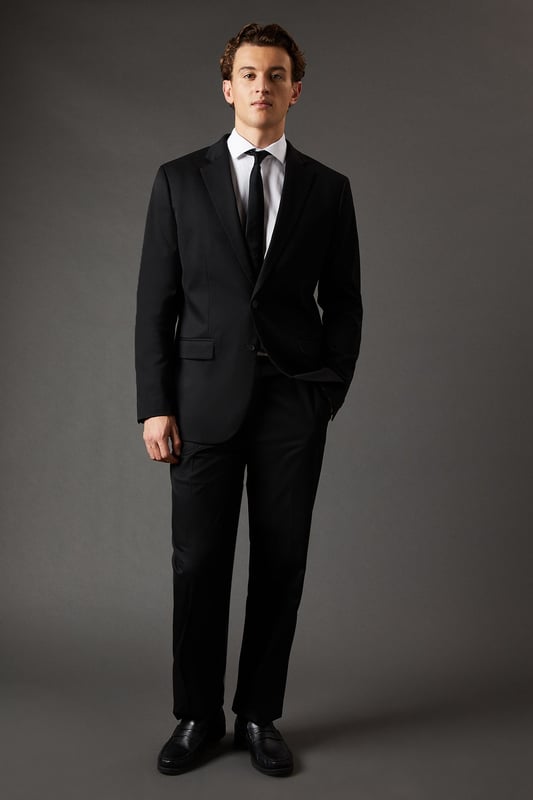 Regular fit suit jacket for a classic, comfortable silhouette
        Notched lapels for a timeless, versatile look
        Two-button front closure for easy wear
        Flap pockets at the waist for practicality and style
        Single back vent for ease of movement
    
    This Burton regular fit suit jacket is the epitome of refined British tailoring, perfect for the discerning gentleman who appreciates classic style with a modern twist. The jacket's regular fit offers a comfortable, relaxed silhouette that flatters various body types, making it an ideal choice for long days at the office or important business meetings. Pair it with matching trousers and a crisp white shirt for a complete look that exudes confidence and professionalism. For more casual affairs, such as after-work drinks or weekend gatherings at the local pub, consider teaming it with dark denim jeans and a light jumper. The versatility of this jacket allows for effortless transitions from day to night, ensuring you're always dressed to impress. Whether you're attending a wedding, giving a presentation, or enjoying a night out on the town, this Burton suit jacket is your go-to piece for looking sharp and feeling comfortable.