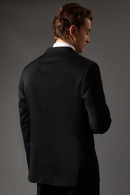 Regular fit suit jacket for a classic, comfortable silhouette
        Notched lapels for a timeless, versatile look
        Two-button front closure for easy wear
        Flap pockets at the waist for practicality and style
        Single back vent for ease of movement
    
    This Burton regular fit suit jacket is the epitome of refined British tailoring, perfect for the discerning gentleman who appreciates classic style with a modern twist. The jacket's regular fit offers a comfortable, relaxed silhouette that flatters various body types, making it an ideal choice for long days at the office or important business meetings. Pair it with matching trousers and a crisp white shirt for a complete look that exudes confidence and professionalism. For more casual affairs, such as after-work drinks or weekend gatherings at the local pub, consider teaming it with dark denim jeans and a light jumper. The versatility of this jacket allows for effortless transitions from day to night, ensuring you're always dressed to impress. Whether you're attending a wedding, giving a presentation, or enjoying a night out on the town, this Burton suit jacket is your go-to piece for looking sharp and feeling comfortable.