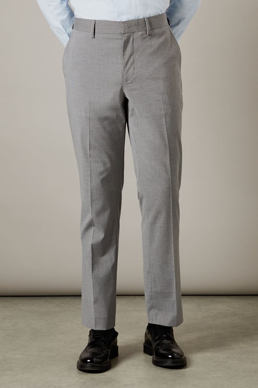 Tailored fit for a refined silhouette
        Textured fabric adds depth and interest
        Belt loops for versatile styling options
        Side pockets for practicality
        Crisp centre crease for a polished look
    
    These Burton suit trousers present a sophisticated option for the discerning gentleman. The tailored fit sculpts the silhouette while offering ease of movement, perfect for the man who values both style and comfort. The textured fabric introduces a subtle element of visual interest, setting these trousers apart from plain alternatives. Pair with the matching jacket for a complete suit, or style separately for smart-casual occasions. For a classic office look, team with a crisp white shirt and polished Oxfords. Alternatively, dress down with a fine-knit jumper and smart trainers for after-work drinks. The versatility of these trousers makes them a valuable addition to any wardrobe, suitable for everything from important business meetings to sophisticated evening events.