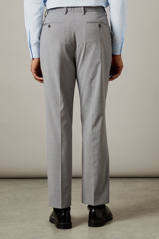 Tailored fit for a refined silhouette
        Textured fabric adds depth and interest
        Belt loops for versatile styling options
        Side pockets for practicality
        Crisp centre crease for a polished look
    
    These Burton suit trousers present a sophisticated option for the discerning gentleman. The tailored fit sculpts the silhouette while offering ease of movement, perfect for the man who values both style and comfort. The textured fabric introduces a subtle element of visual interest, setting these trousers apart from plain alternatives. Pair with the matching jacket for a complete suit, or style separately for smart-casual occasions. For a classic office look, team with a crisp white shirt and polished Oxfords. Alternatively, dress down with a fine-knit jumper and smart trainers for after-work drinks. The versatility of these trousers makes them a valuable addition to any wardrobe, suitable for everything from important business meetings to sophisticated evening events.