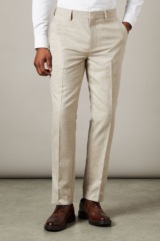Slim fit design for a modern, tailored silhouette
        Semi-plain fabric adds subtle texture and interest
        Belt loops for versatile styling options
        Side pockets for practicality
        Pressed centre creases for a sharp, polished look
    
    These Burton slim fit suit trousers offer a contemporary take on classic tailoring. The semi-plain fabric provides a refined appearance with a touch of visual interest, perfect for the discerning gent who appreciates subtle style. The slim fit cut creates a sleek silhouette that's ideal for both office wear and smart-casual events. Pair these trousers with a crisp white shirt and brown leather brogues for a sophisticated look that transitions seamlessly from boardroom to bar. For a more relaxed ensemble, team with a light knit jumper and smart trainers. The versatility of these trousers makes them a wardrobe essential for the modern man who values both style and practicality in his attire.