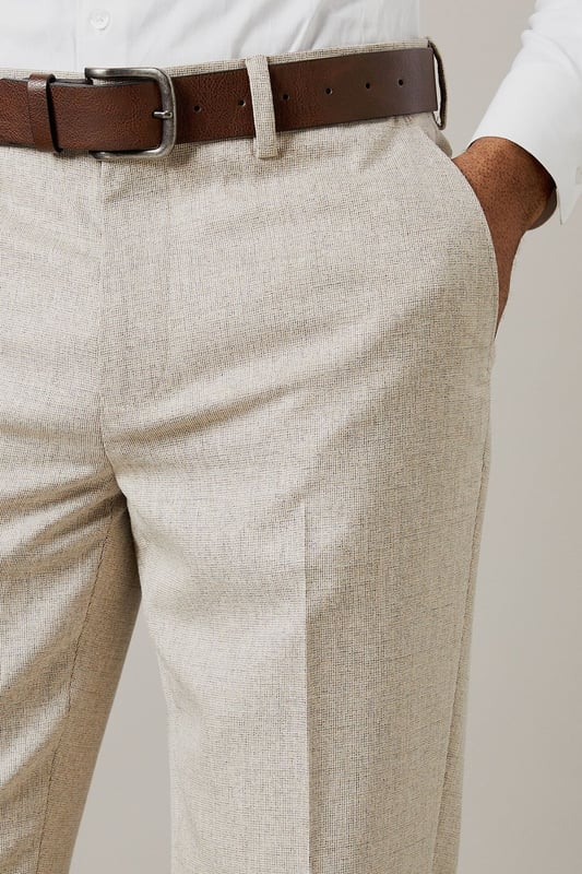 Slim fit design for a modern, tailored silhouette
        Semi-plain fabric adds subtle texture and interest
        Belt loops for versatile styling options
        Side pockets for practicality
        Pressed centre creases for a sharp, polished look
    
    These Burton slim fit suit trousers offer a contemporary take on classic tailoring. The semi-plain fabric provides a refined appearance with a touch of visual interest, perfect for the discerning gent who appreciates subtle style. The slim fit cut creates a sleek silhouette that's ideal for both office wear and smart-casual events. Pair these trousers with a crisp white shirt and brown leather brogues for a sophisticated look that transitions seamlessly from boardroom to bar. For a more relaxed ensemble, team with a light knit jumper and smart trainers. The versatility of these trousers makes them a wardrobe essential for the modern man who values both style and practicality in his attire.
