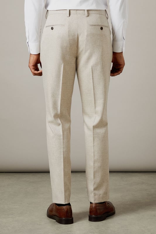Slim fit design for a modern, tailored silhouette
        Semi-plain fabric adds subtle texture and interest
        Belt loops for versatile styling options
        Side pockets for practicality
        Pressed centre creases for a sharp, polished look
    
    These Burton slim fit suit trousers offer a contemporary take on classic tailoring. The semi-plain fabric provides a refined appearance with a touch of visual interest, perfect for the discerning gent who appreciates subtle style. The slim fit cut creates a sleek silhouette that's ideal for both office wear and smart-casual events. Pair these trousers with a crisp white shirt and brown leather brogues for a sophisticated look that transitions seamlessly from boardroom to bar. For a more relaxed ensemble, team with a light knit jumper and smart trainers. The versatility of these trousers makes them a wardrobe essential for the modern man who values both style and practicality in his attire.