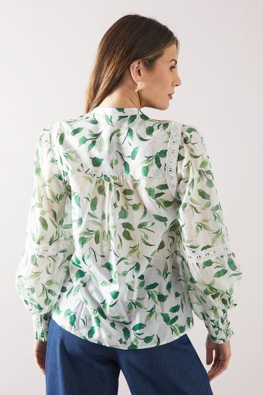 Charming floral print blouse with delicate lace inserts
        Elegant crew neckline with tie-front detail
        Long sleeves with gathered cuffs for a feminine touch
        Flattering loose fit for comfort and style
        Versatile design suitable for various daytime occasions
    
    Embrace effortless sophistication with this enchanting floral printed blouse from Wallis. The intricate lace inserts add a touch of romance, while the tie-front detail at the neckline allows for customisable styling. Perfect for those who appreciate comfort without compromising on glamour, this blouse pairs beautifully with wide-leg trousers as shown, or your favourite A-line skirt. Ideal for family gatherings, casual brunches, or a day out shopping, this versatile piece can be dressed up or down with ease. Add a statement belt and some delicate jewellery to complete your look. For a relaxed yet put-together ensemble, team with comfortable flats and a tote bag. This blouse is a wardrobe essential that will have you looking polished and feeling confident for any daytime event.