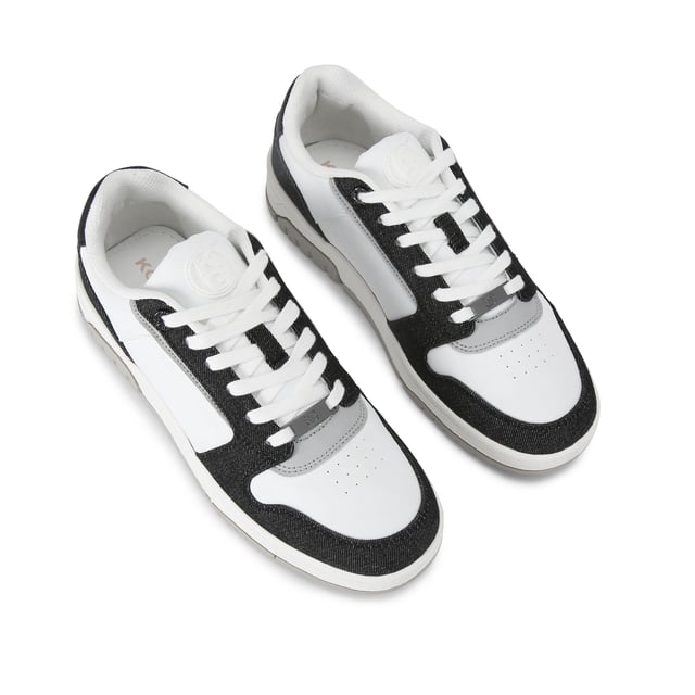 This KG Kurt Geiger Ryder 2 sneaker features a white upper with black denim panel detail. The front laces up with a gunmetal branded plate. There is embossed branding on the side and tongue.