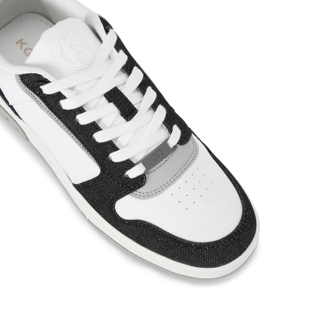 This KG Kurt Geiger Ryder 2 sneaker features a white upper with black denim panel detail. The front laces up with a gunmetal branded plate. There is embossed branding on the side and tongue.
