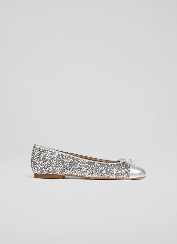 LK Bennett Kara Flats, Silver No wardrobe should be without a classic kitten heel. Cue Audrey, our much-loved kitten heel courts. Crafted in Spain from super-soft paprika-hued suede, this LKB sigture style has a pointed toe, a sleek silhouette and a 55mm kitten heel. Stylish and wearable, Audrey makes a timeless addition to any shoe collection.