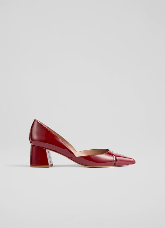Cecile closed courts blend sophistication with modern flair. Crafted in striking red patent leather, these Spanish crafted courts feature a sleek cut-out design and a pointed toe atop a stylish block heel. Versatile for any occasion, pair them with tailored trousers for a chic office look or a flowing midi dress for an evening out. Enhance your everyday style effortlessly.