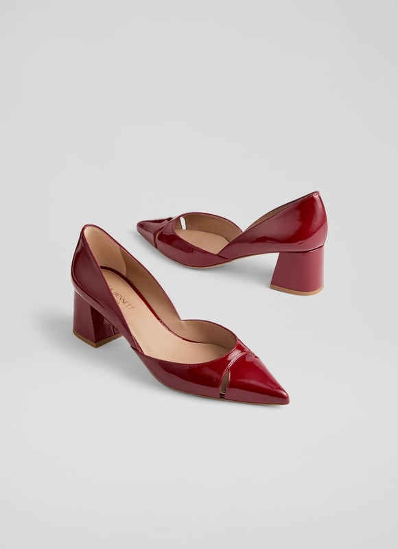 Cecile closed courts blend sophistication with modern flair. Crafted in striking red patent leather, these Spanish crafted courts feature a sleek cut-out design and a pointed toe atop a stylish block heel. Versatile for any occasion, pair them with tailored trousers for a chic office look or a flowing midi dress for an evening out. Enhance your everyday style effortlessly.
