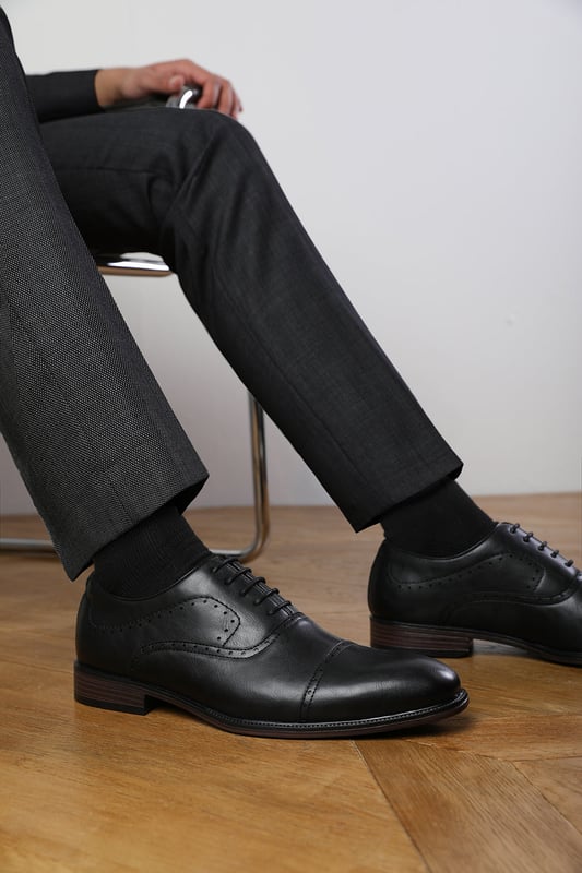 Enhance your formal footwear collection with these  Adam textured oxford lace up work dress shoes. Designed with sophistication and comfort in mind, these shoes are the perfect choice for formal occasions, business meetings, or evening events. 
Key Features: 
 Chic Design: The lace up offers a distinctive and stylish look, setting these shoes apart from conventional formal footwear. The smooth leather finish and clean lines create a polished and sophisticated appearance. 
  Durable Construction: Made with high-quality PU material, these shoes are built to last. The sturdy outsole ensures reliable wear, while the precise stitching adds durability and refinement to the overall design. 
   Comfortable Fit: Designed for all-day wear, these shoes feature a padded insole that provides excellent cushioning. The slip-resistant outsole ensures stability and comfort, making them ideal for long hours of wear. 
Specifications 
Material: Premium-quality faux leather 
Closure: Lace up. 
Outsole: Durable and slip-resistant 
Elevate your formal attire with these Michael textured oxford lace up work dress shoes. Combining style, durability, and comfort, they are an essential addition to any wardrobe. Perfect for professionals and fashion-forward individuals alike!