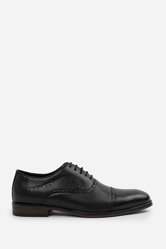 Enhance your formal footwear collection with these  Adam textured oxford lace up work dress shoes. Designed with sophistication and comfort in mind, these shoes are the perfect choice for formal occasions, business meetings, or evening events. 
Key Features: 
 Chic Design: The lace up offers a distinctive and stylish look, setting these shoes apart from conventional formal footwear. The smooth leather finish and clean lines create a polished and sophisticated appearance. 
  Durable Construction: Made with high-quality PU material, these shoes are built to last. The sturdy outsole ensures reliable wear, while the precise stitching adds durability and refinement to the overall design. 
   Comfortable Fit: Designed for all-day wear, these shoes feature a padded insole that provides excellent cushioning. The slip-resistant outsole ensures stability and comfort, making them ideal for long hours of wear. 
Specifications 
Material: Premium-quality faux leather 
Closure: Lace up. 
Outsole: Durable and slip-resistant 
Elevate your formal attire with these Michael textured oxford lace up work dress shoes. Combining style, durability, and comfort, they are an essential addition to any wardrobe. Perfect for professionals and fashion-forward individuals alike!