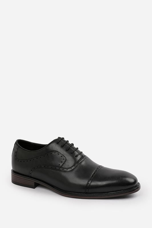 Enhance your formal footwear collection with these  Adam textured oxford lace up work dress shoes. Designed with sophistication and comfort in mind, these shoes are the perfect choice for formal occasions, business meetings, or evening events. 
Key Features: 
 Chic Design: The lace up offers a distinctive and stylish look, setting these shoes apart from conventional formal footwear. The smooth leather finish and clean lines create a polished and sophisticated appearance. 
  Durable Construction: Made with high-quality PU material, these shoes are built to last. The sturdy outsole ensures reliable wear, while the precise stitching adds durability and refinement to the overall design. 
   Comfortable Fit: Designed for all-day wear, these shoes feature a padded insole that provides excellent cushioning. The slip-resistant outsole ensures stability and comfort, making them ideal for long hours of wear. 
Specifications 
Material: Premium-quality faux leather 
Closure: Lace up. 
Outsole: Durable and slip-resistant 
Elevate your formal attire with these Michael textured oxford lace up work dress shoes. Combining style, durability, and comfort, they are an essential addition to any wardrobe. Perfect for professionals and fashion-forward individuals alike!