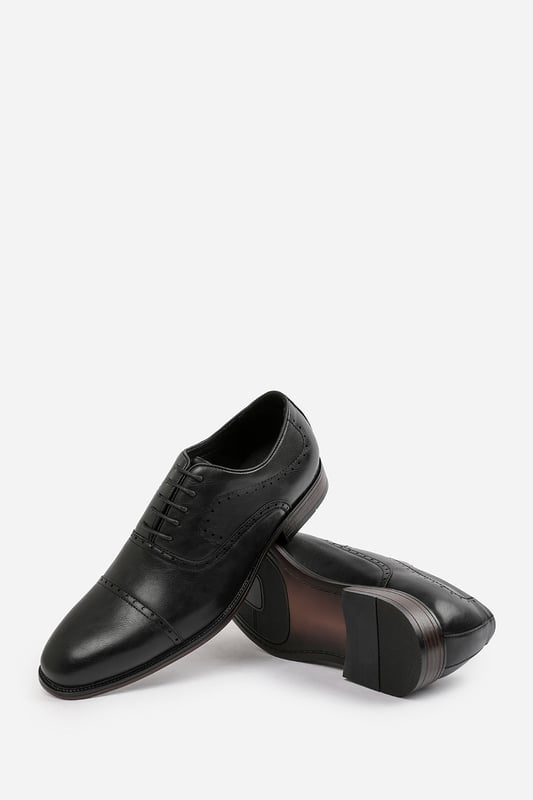 Enhance your formal footwear collection with these  Adam textured oxford lace up work dress shoes. Designed with sophistication and comfort in mind, these shoes are the perfect choice for formal occasions, business meetings, or evening events. 
Key Features: 
 Chic Design: The lace up offers a distinctive and stylish look, setting these shoes apart from conventional formal footwear. The smooth leather finish and clean lines create a polished and sophisticated appearance. 
  Durable Construction: Made with high-quality PU material, these shoes are built to last. The sturdy outsole ensures reliable wear, while the precise stitching adds durability and refinement to the overall design. 
   Comfortable Fit: Designed for all-day wear, these shoes feature a padded insole that provides excellent cushioning. The slip-resistant outsole ensures stability and comfort, making them ideal for long hours of wear. 
Specifications 
Material: Premium-quality faux leather 
Closure: Lace up. 
Outsole: Durable and slip-resistant 
Elevate your formal attire with these Michael textured oxford lace up work dress shoes. Combining style, durability, and comfort, they are an essential addition to any wardrobe. Perfect for professionals and fashion-forward individuals alike!