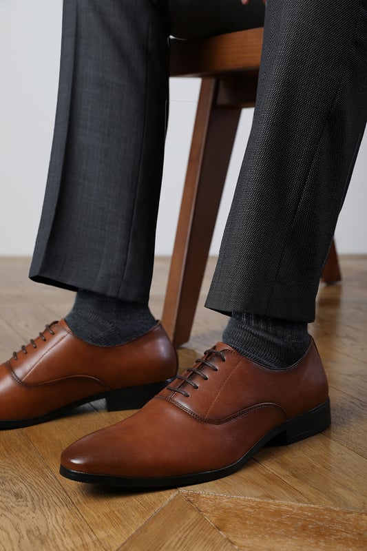 Enhance your formal footwear collection with these  Michael oxford lace up work dress shoes . Designed with sophistication and comfort in mind, these shoes are the perfect choice for formal occasions, business meetings, or evening events. 
Key Features: 
 Chic Design: The lace up offers a distinctive and stylish look, setting these shoes apart from conventional formal footwear. The smooth leather finish and clean lines create a polished and sophisticated appearance. 
   Durable Construction: Made with high-quality PU material, these shoes are built to last. The sturdy outsole ensures reliable wear, while the precise stitching adds durability and refinement to the overall design. 
   Comfortable Fit: Designed for all-day wear, these shoes feature a padded insole that provides excellent cushioning. The slip-resistant outsole ensures stability and comfort, making them ideal for long hours of wear. 
Specifications 
Material: Premium-quality faux leather 
Closure: Lace up. 
Outsole: Durable and slip-resistant 
Elevate your formal attire with these Nick oxford lace up work dress shoes. Combining style, durability, and comfort, they are an essential addition to any wardrobe. Perfect for professionals and fashion-forward individuals alike!