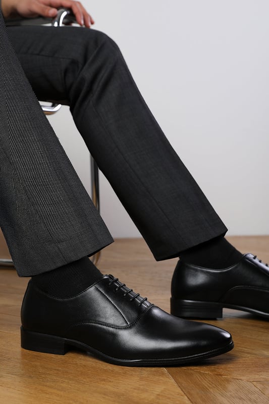 Enhance your formal footwear collection with these  Michael oxford lace up work dress shoes . Designed with sophistication and comfort in mind, these shoes are the perfect choice for formal occasions, business meetings, or evening events. 
Key Features: 
 Chic Design: The lace up offers a distinctive and stylish look, setting these shoes apart from conventional formal footwear. The smooth leather finish and clean lines create a polished and sophisticated appearance. 
   Durable Construction: Made with high-quality PU material, these shoes are built to last. The sturdy outsole ensures reliable wear, while the precise stitching adds durability and refinement to the overall design. 
   Comfortable Fit: Designed for all-day wear, these shoes feature a padded insole that provides excellent cushioning. The slip-resistant outsole ensures stability and comfort, making them ideal for long hours of wear. 
Specifications 
Material: Premium-quality faux leather 
Closure: Lace up. 
Outsole: Durable and slip-resistant 
Elevate your formal attire with these Nick oxford lace up work dress shoes. Combining style, durability, and comfort, they are an essential addition to any wardrobe. Perfect for professionals and fashion-forward individuals alike!