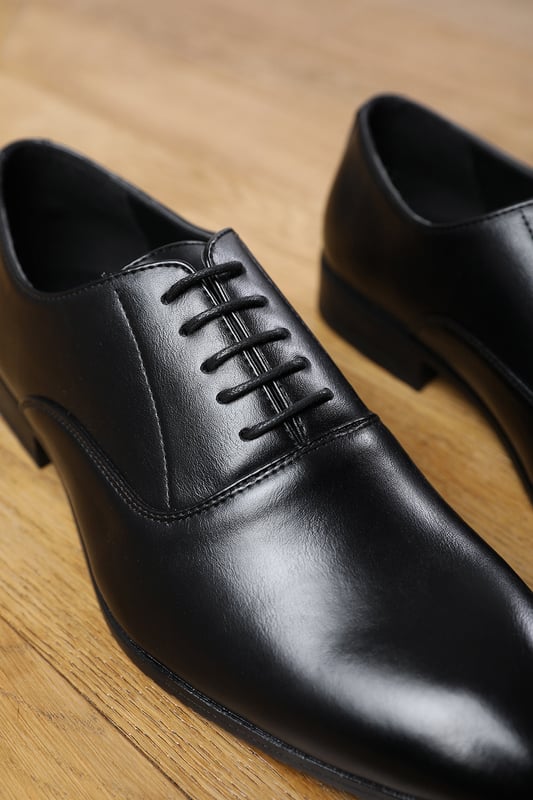 Enhance your formal footwear collection with these  Michael oxford lace up work dress shoes . Designed with sophistication and comfort in mind, these shoes are the perfect choice for formal occasions, business meetings, or evening events. 
Key Features: 
 Chic Design: The lace up offers a distinctive and stylish look, setting these shoes apart from conventional formal footwear. The smooth leather finish and clean lines create a polished and sophisticated appearance. 
   Durable Construction: Made with high-quality PU material, these shoes are built to last. The sturdy outsole ensures reliable wear, while the precise stitching adds durability and refinement to the overall design. 
   Comfortable Fit: Designed for all-day wear, these shoes feature a padded insole that provides excellent cushioning. The slip-resistant outsole ensures stability and comfort, making them ideal for long hours of wear. 
Specifications 
Material: Premium-quality faux leather 
Closure: Lace up. 
Outsole: Durable and slip-resistant 
Elevate your formal attire with these Nick oxford lace up work dress shoes. Combining style, durability, and comfort, they are an essential addition to any wardrobe. Perfect for professionals and fashion-forward individuals alike!