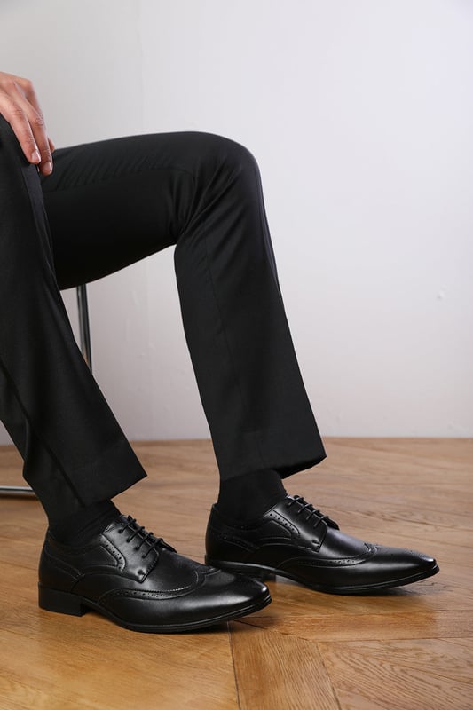 Elevate your formal style with these Dominic lace up derby textured formal dress work shoes. With a lace-up design, these shoes add a timeless appeal, perfect for any formal occasion. Step up your formal game with these elegant elliot Lace Up Derby textured Shoes, a perfect blend of style and comfort.

Key Features: 



Formal Design:   These shoes feature a sleek and classic design that adds sophistication to your outfit. The lace-up design adds a touch of visual interest, making these shoes stand out.

Comfortable Fit:   The shoes provides a comfortable and stable fit that is suitable for all-day wear. The lace up allows for an adjustable and secure fit, ensuring that these shoes stay comfortably on your feet.

Durable Construction:   Crafted with high-quality materials, these shoes are built to last. The sturdy construction ensures durability and longevity, making them a reliable choice for regular wear.

Suitable for Any Occasion: perfect for formal occasions or simply want to elevate your everyday look, these shoes are suitable for any occasion. Their formal design and comfortable fit make them a versatile choice for all-day wear.

    Specification:-    Pattern: Solid    Upper Material: PU    Occasion: Formal    Product Type: Derby Shoes    Shoe Type: Lace-Up    Invest in our Elliot lace up derby textured formal dress work shoes and experience the perfect blend of style, comfort, and durability. Pair it with earthy tones like beige, grey, or brown chinos, or opt for a more dressy pants variant, and step out with confidence.
