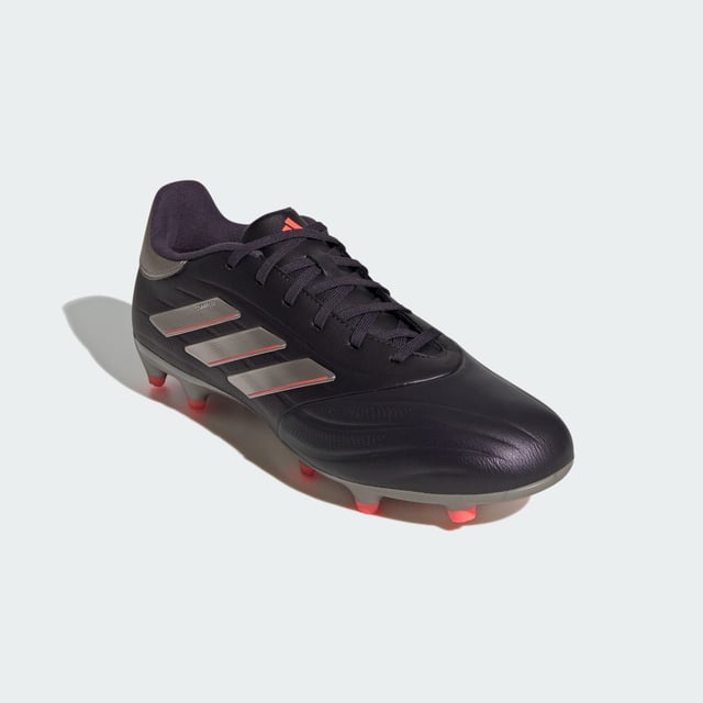 From brain to boot, and back again. Connect with the ball on every level in adidas Copa Pure 2. The comfortable upper on these League boots shows off vintage details, ensuring you look and feel as classy as your football. Its cow leather forefoot delivers a cultured touch. Underneath, a firm ground outsole makes for unflustered play.This product features at least 20% recycled materials. By reusing materials that have already been created, adidas help to reduce waste and our reliance on finite resources and reduce the footprint of the products adidas make.  - Regular fit - Lace closure - Synthetic upper with leather forefoot - Firm ground outsole - Contains at least 20% recycled content  Shipped by adidas