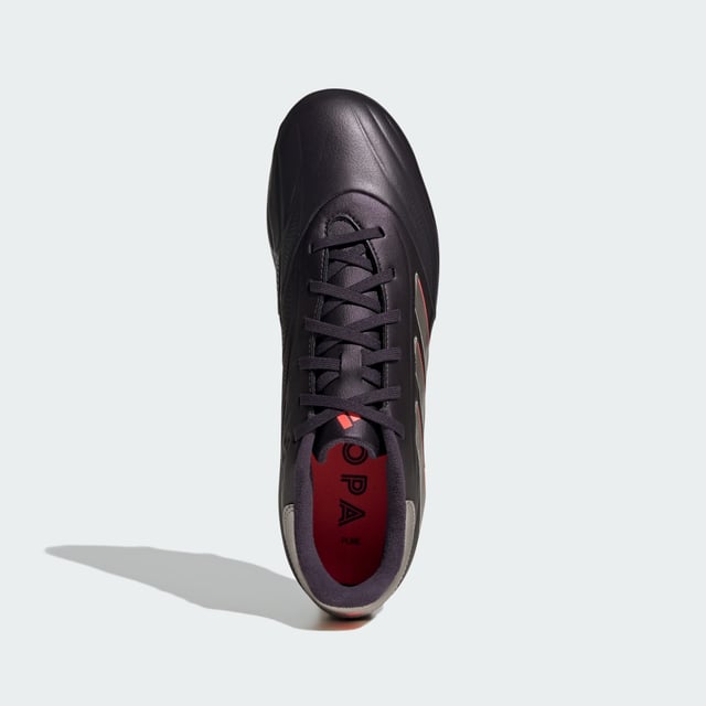 From brain to boot, and back again. Connect with the ball on every level in adidas Copa Pure 2. The comfortable upper on these League boots shows off vintage details, ensuring you look and feel as classy as your football. Its cow leather forefoot delivers a cultured touch. Underneath, a firm ground outsole makes for unflustered play.This product features at least 20% recycled materials. By reusing materials that have already been created, adidas help to reduce waste and our reliance on finite resources and reduce the footprint of the products adidas make.  - Regular fit - Lace closure - Synthetic upper with leather forefoot - Firm ground outsole - Contains at least 20% recycled content  Shipped by adidas